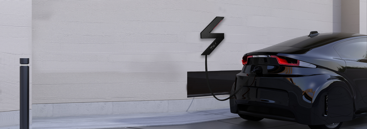 An EVX Home charger on a garage wall beside an electric car.