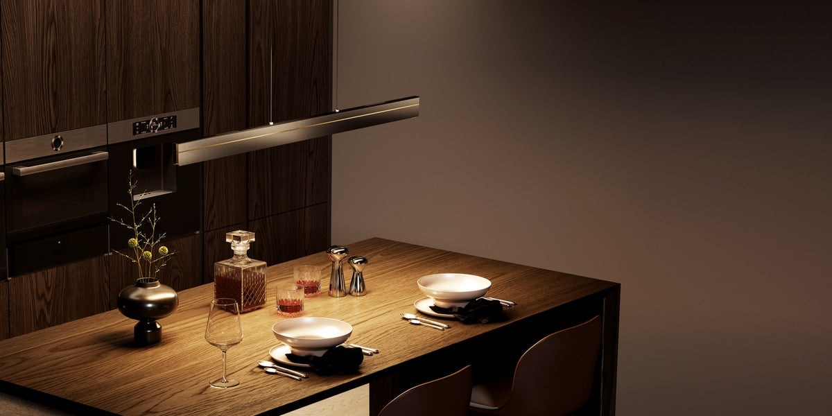 Warm pendant light over a dining table